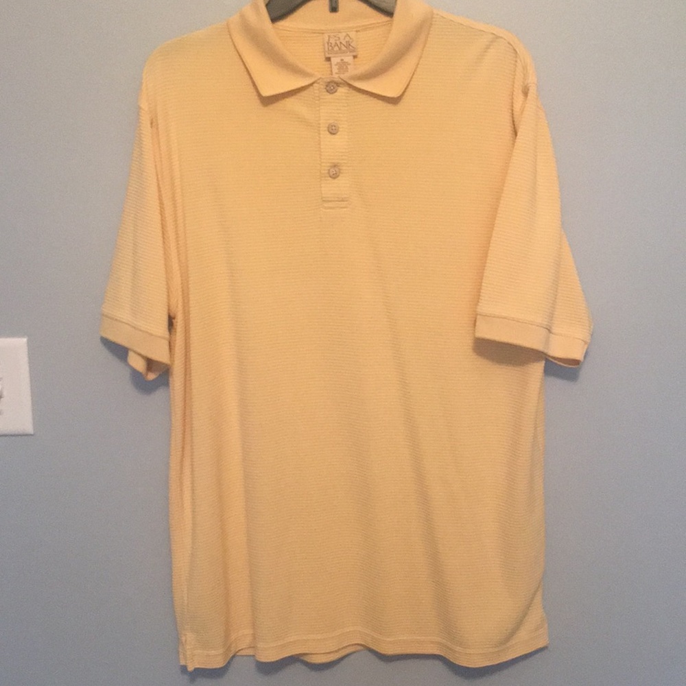 Jos A. Banks yellow ribbed polo shirt.